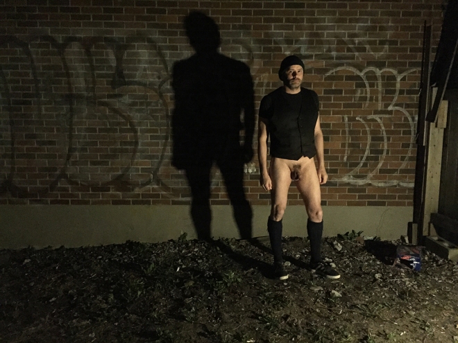 Photo of Jade Sambrook without his kilt in a trashy dark back alley from the Trashy Dark Naked Alley Photo Series.