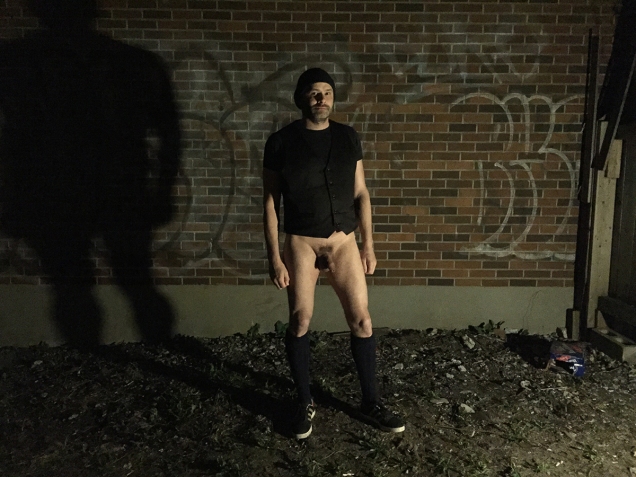 Photo of Jade Sambrook without his kilt in a trashy dark back alley from the Trashy Dark Naked Alley Photo Series.