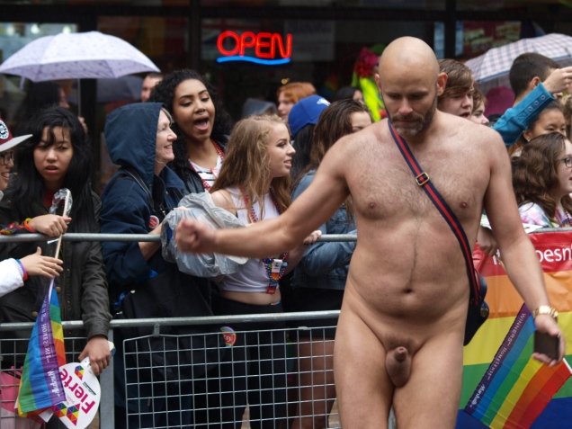 Jade Sambrook dancing naked in front of a crowd of onlookers gathered along the route of the 2015 Toronto Pride Parade.